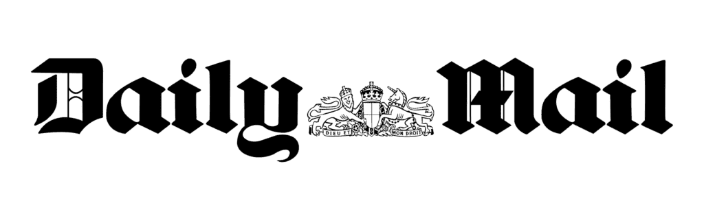 Alt text: a white emblem featuring a central crown flanked by two rampant heraldic lions on a black background, with a banner below containing the phrase "dieu et mon droit" related to hair